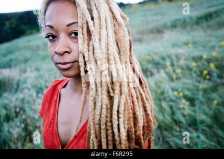 Black woman walking in field Stock Photo