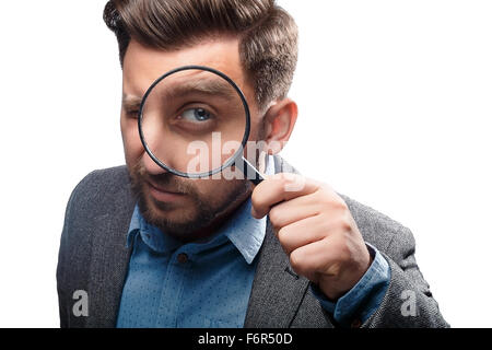 Man with magnifying glass on white background Stock Photo