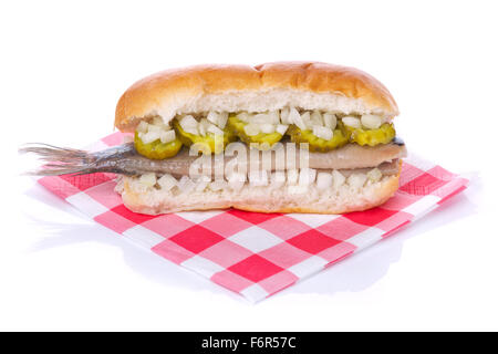 A Dutch herring sandwich isolated on white. A traditional Dutch delicacy, with peak season at the end of spring when the first y Stock Photo