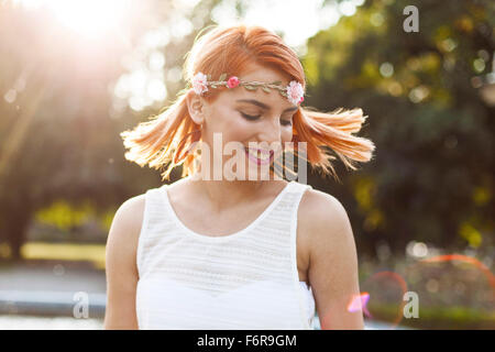 Young woman in hippie style fashion flicking her hair Stock Photo