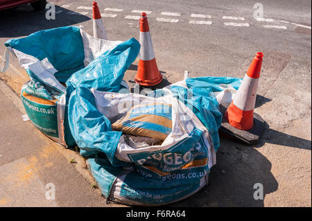 Bags used by building supplier at side of road by building site in the Uk Stock Photo