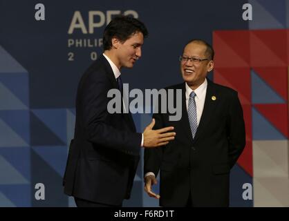 Manila, Philippines. 19th November, 2015. Philippine President Benigno Aquino III greets Canadian Prime Minister Justin Trudeau during the APEC Leaders Summit at the Philippine International Convention Center November 19, 2015 in Pasay City, Manila, Philippines. Stock Photo