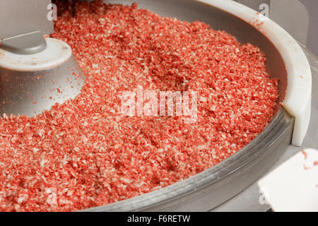 Raw ground beef minced in a big factory bowl Stock Photo