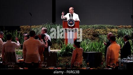 Manila, Philippines. 19th November, 2015. Philippine President Benigno Aquino III toasts world leaders during the APEC Leaders Summit welcome dinner at the SM Mall of Asia Arena November 18, 2015 in Manila, Philippines. Stock Photo