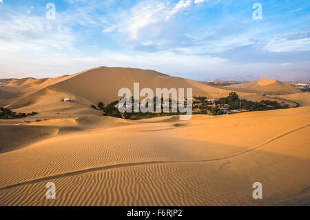 Hucachina oasis in sand dunes near Ica, Peru Stock Photo