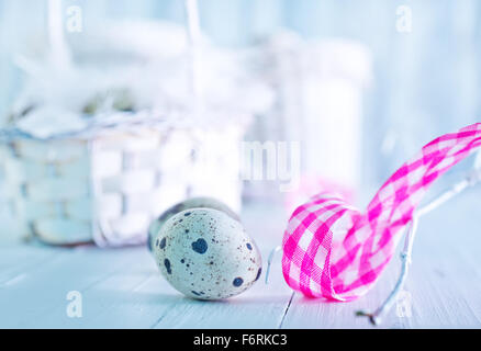 quail eggs in basket and on a table Stock Photo