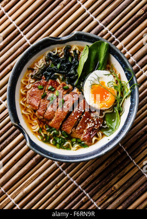 Asian soup with noodles in bowl top view Stock Photo - Alamy