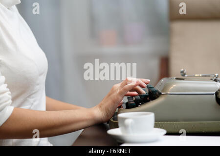 Hands writing on typewriter Stock Photo