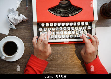 Hands on typing machine Stock Photo