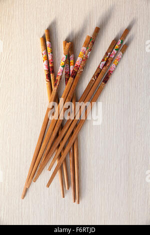 group of Chinese chopsticks on wooden table Stock Photo