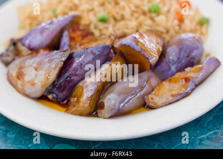 Chinese sauteed eggplant with oyster sauce and fried rice Stock Photo