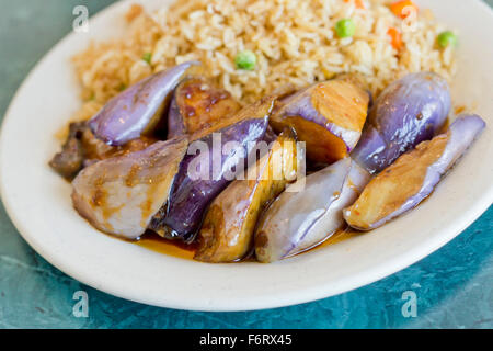 Chinese sauteed eggplant with oyster sauce and fried rice Stock Photo