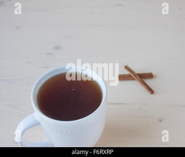 Hot apple cider with cinnamon sticks Stock Photo