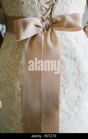 Close up of sash on wedding dress Stock Photo