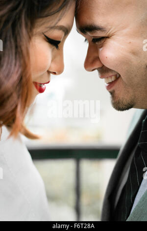 Japanese couple touching foreheads Stock Photo