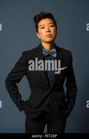 Androgynous woman wearing suit Stock Photo