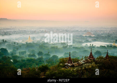 Aerial view of towers in misty landscape