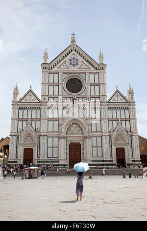 A tourist in front of Basilica Santa Croce, Florence, Italy. Stock Photo