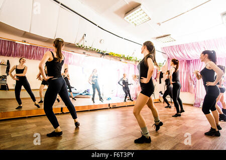 Caucasian dancers practicing in studio Stock Photo