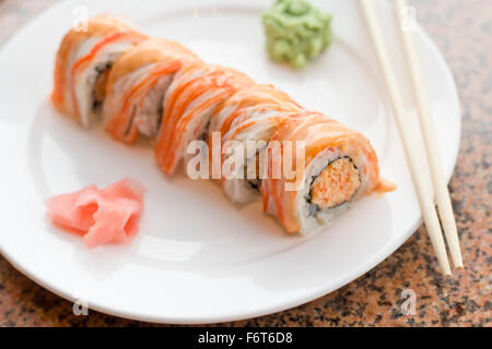 Beautiful spicy crab roll with wasabi and fresh pickled ginger Stock Photo