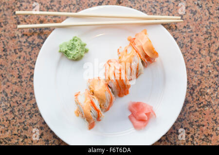 Beautiful spicy crab roll with wasabi and fresh pickled ginger Stock Photo