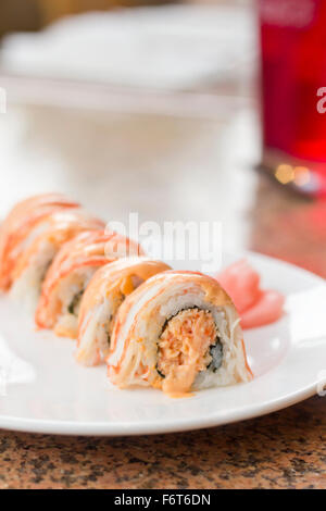 Beautiful spicy crab roll with wasabi and fresh pickled ginger Stock Photo