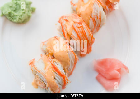 Beautiful spicy crab roll with wasabi and fresh pickled ginger Stock Photo