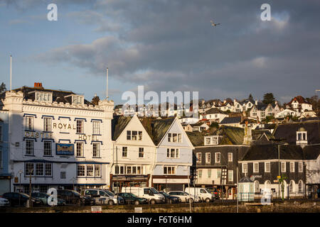 Morning winter sun shines on the Royal Castle Hotel and surrounding buildings on the quay in Dartmouth. Stock Photo