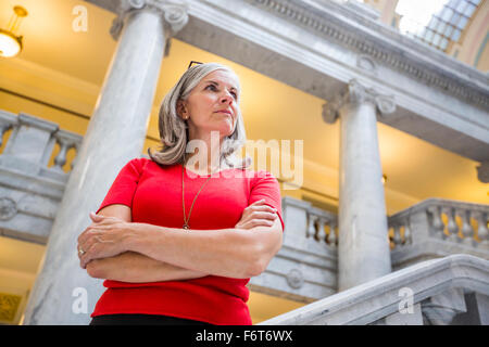 Caucasian businesswoman standing in courthouse Stock Photo