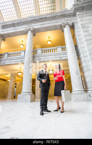 Business people talking in courthouse Stock Photo