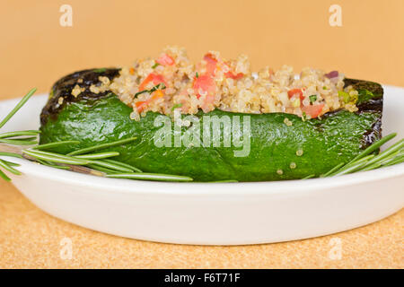 Grilled quinoa salad stuffed zucchini with rosemary Stock Photo