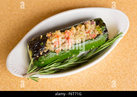 Grilled quinoa salad stuffed zucchini with rosemary Stock Photo
