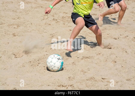 Beach soccer game in the yearly tournament at Tappet beach in Åhus Sweden in June 2014. Stock Photo