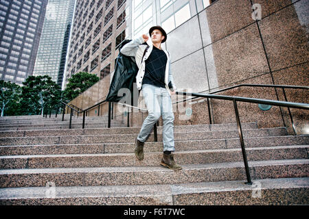 Caucasian businessman walking on steps Stock Photo