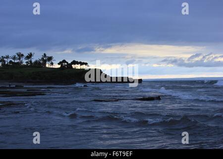 The amazing beach and sea from Tanah Lot Temple in Bali, Indonesia, at sunset time Stock Photo