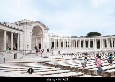 Pictured here is a view of the Memorial Amphitheater at Arlington National Cemetery with people visible, Stock Photo