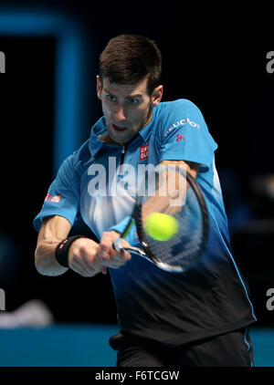 London, UK. 19th Nov, 2015. Serbia's Novak Djokovic plays a shot against Czech Republic's Tomas Berdych during a men's singles match the ATP World Tour Finals tennis tournament in London on Nov. 19, 2015. Djokovic won 2-0. Credit:  Han Yan/Xinhua/Alamy Live News Stock Photo