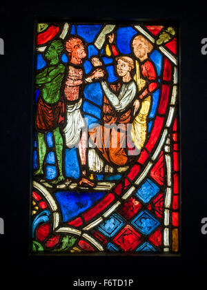 Devils and monks in stained glass. Medieval Stained Glass Collection at Cluny. Stained glass example from the museum Stock Photo