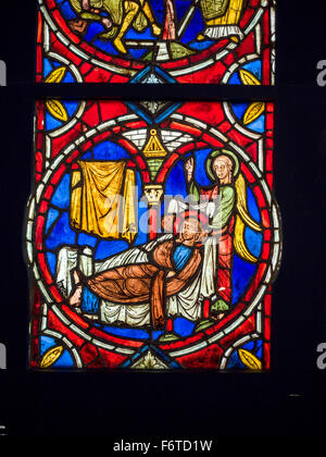 Jesus Raising Lazarus panel from Cluny. Medieval Stained Glass Collection at Cluny. Stained glass example from the museum Stock Photo