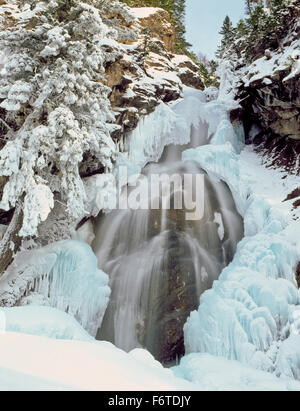 holland falls and ice formations in winter above holland lake near condon, montana Stock Photo