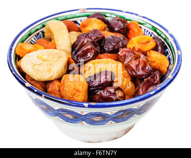 Central Asian dried fruits in typical ceramic bowl isolated on white background Stock Photo
