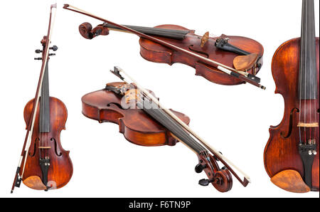 set of old violins with bows isolated on white background Stock Photo