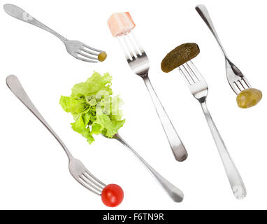 set of forks with different snacks isolated on white background Stock Photo
