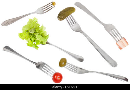 set of forks with impaled foods isolated on white background Stock Photo