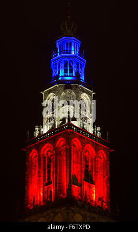 Groningen, Holland, November 16, 2015. Martinitower in Groningen lighted with the Tricolor in a show of support for France. Stock Photo