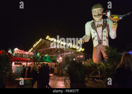 London, UK. 19 November 2015. The Bavarian Village with beer tent and food stalls. Hyde Park Winter Wonderland opens with many attractions such as fairground rides, Christmas markets, a circus and a Bavarian Beer Village. The fairground is open until 3 January 2016. Credit:  Vibrant Pictures/Alamy Live News Stock Photo