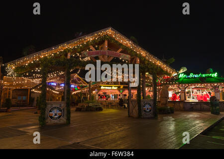 London, UK. 19 November 2015. The Bavarian Village with beer tent and food stalls. Hyde Park Winter Wonderland opens with many attractions such as fairground rides, Christmas markets, a circus and a Bavarian Beer Village. The fairground is open until 3 January 2016. Credit:  Vibrant Pictures/Alamy Live News Stock Photo