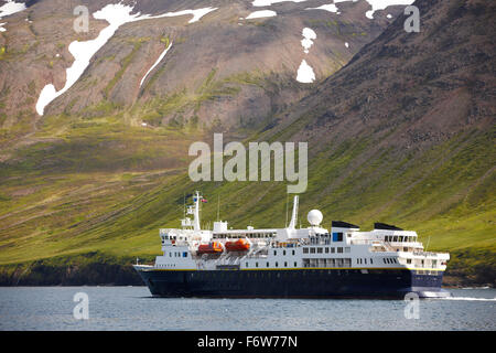 Passengers ferry on Siglufjordur fjord in the background Iceland Stock Photo