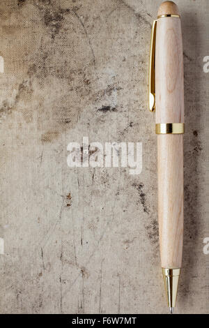Ballpen with copy-space on old canvas grunge background Stock Photo