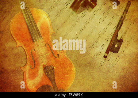 Classic violin on grunge paper texture. Stock Photo